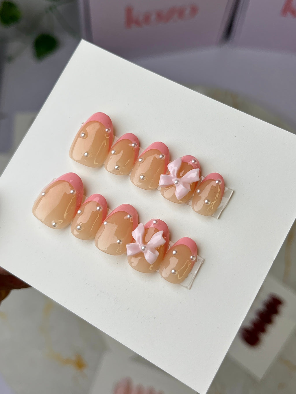 Pink bow short oval French tips