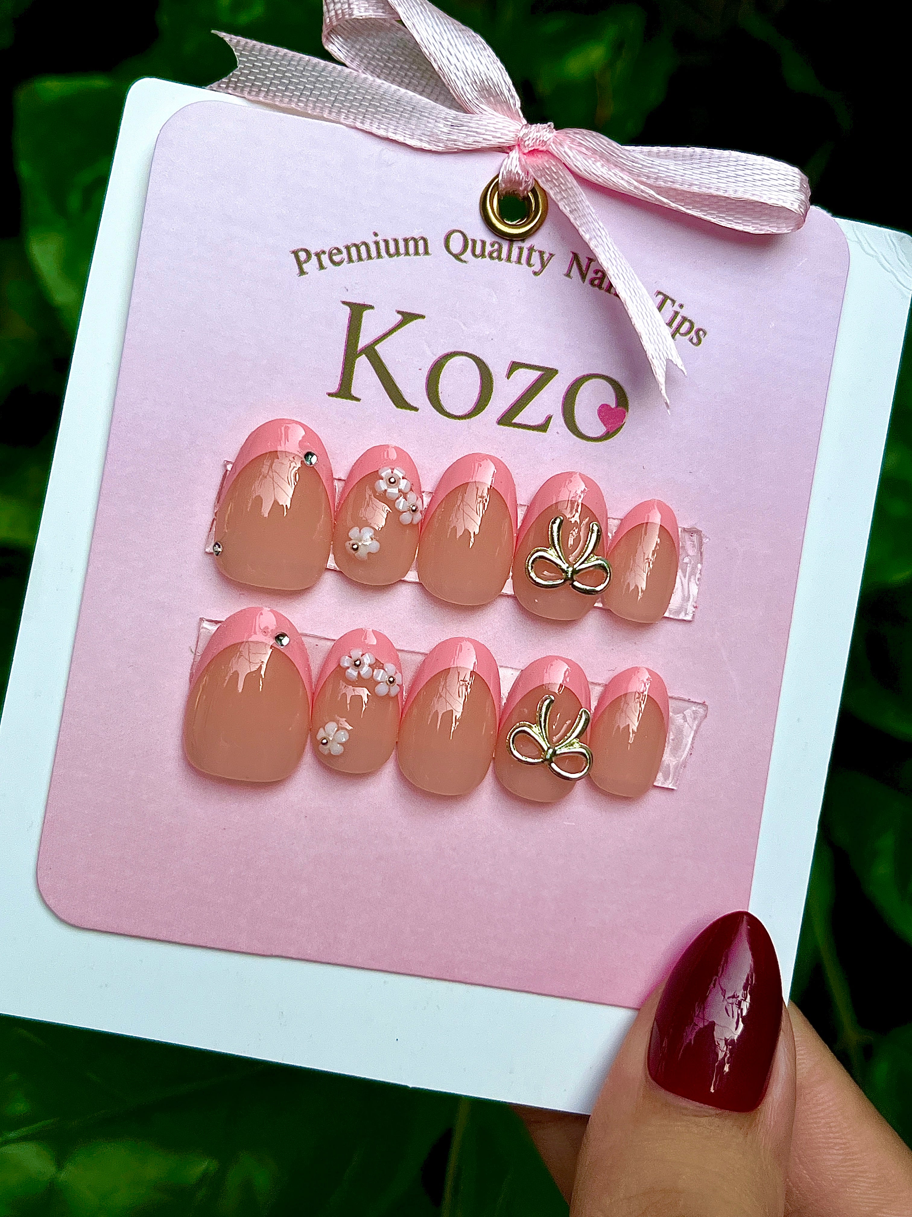 Pink French tips with silver bow