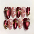 Red cat eye nails with pink flowers