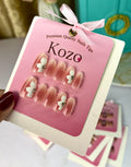 Oval shaped blush 3D flowers nails