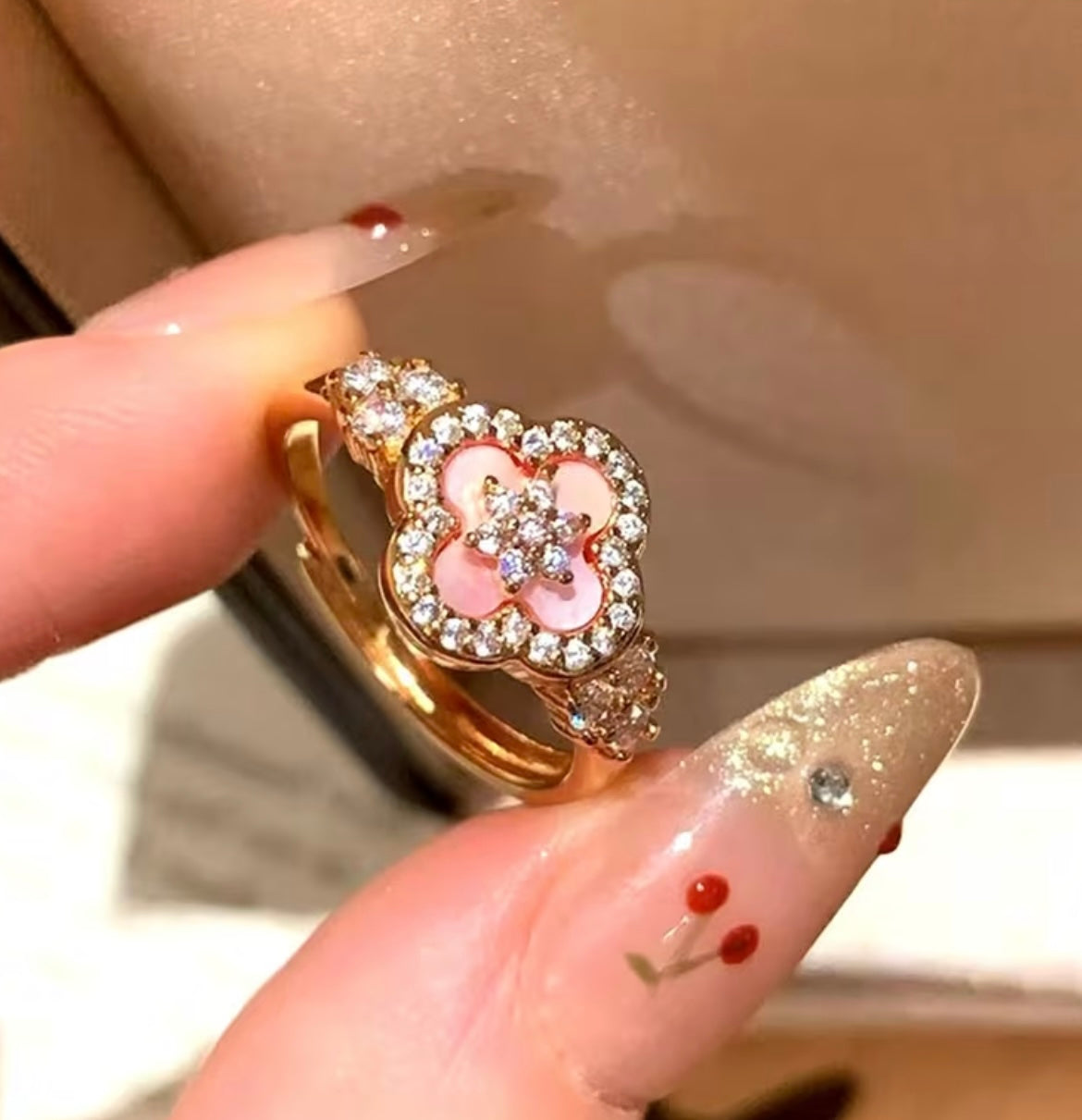 Adjustable pink van cleef ring
