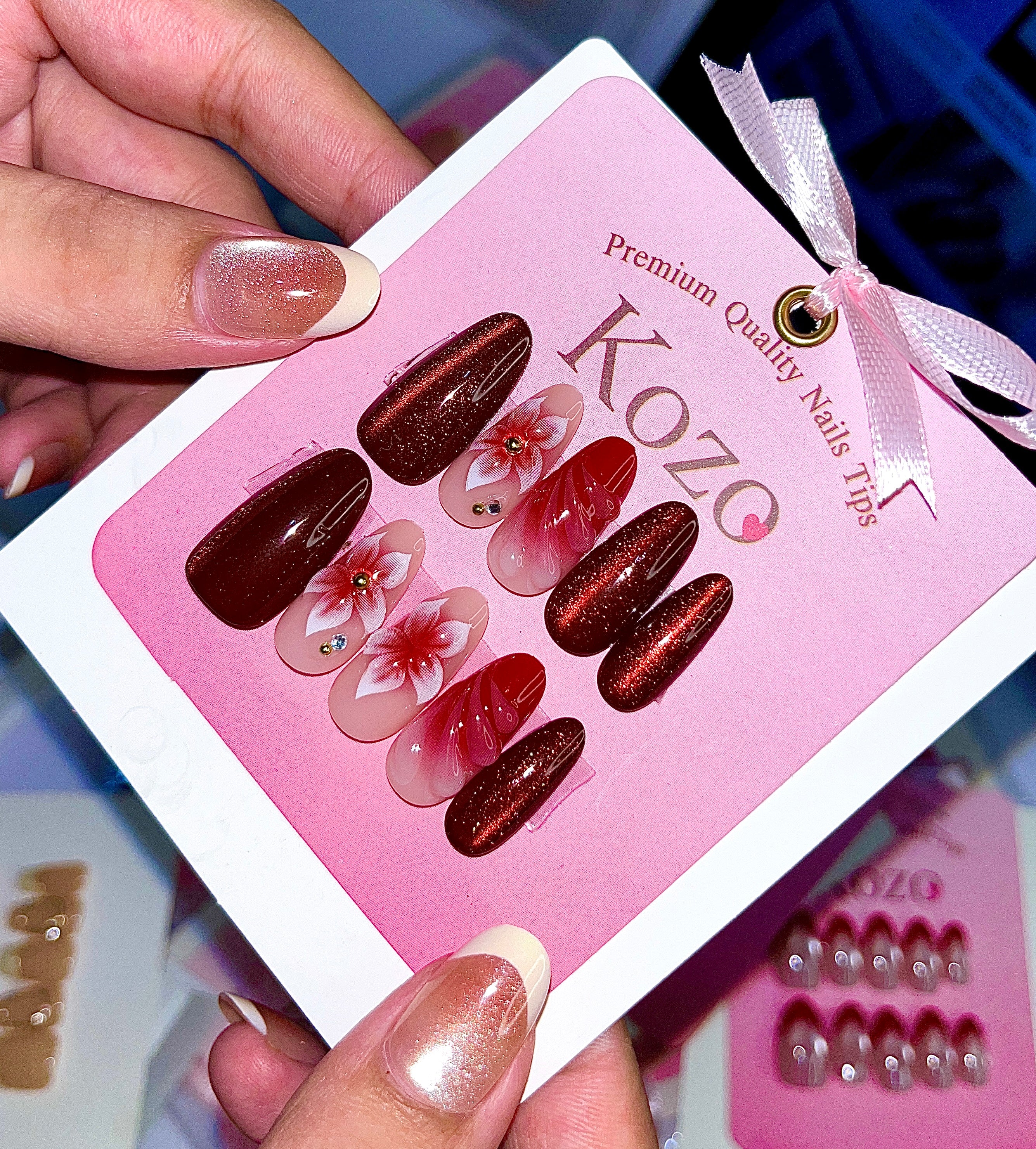 Red cat eye nails with 3D flowers