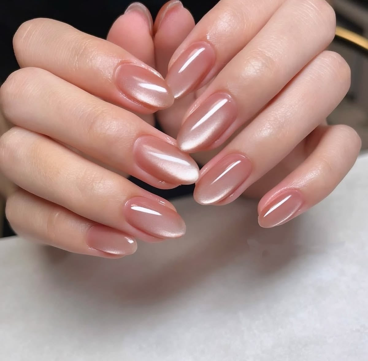 Oval shaped peach cat eye nails