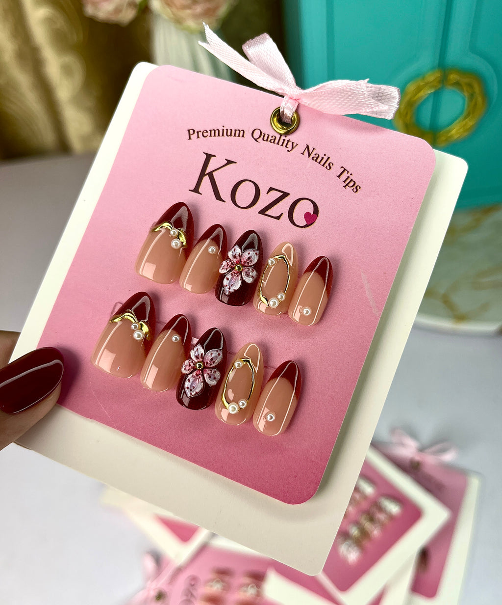 Red nails with golden chrome