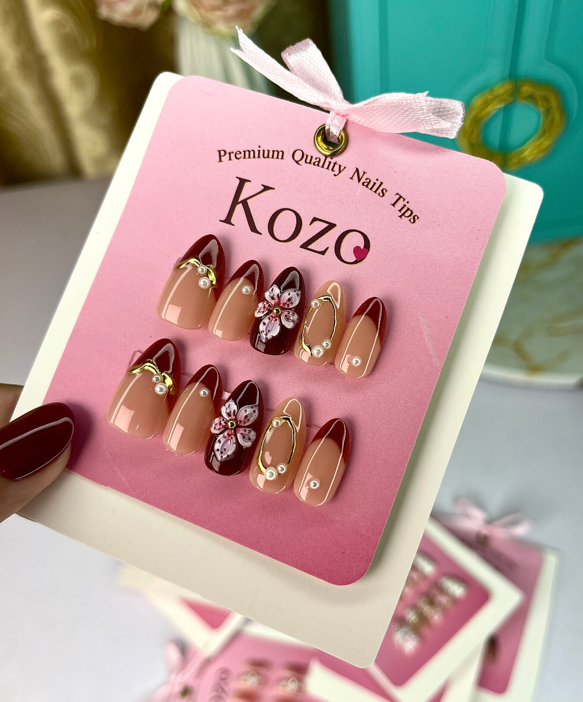 Red nails with golden chrome