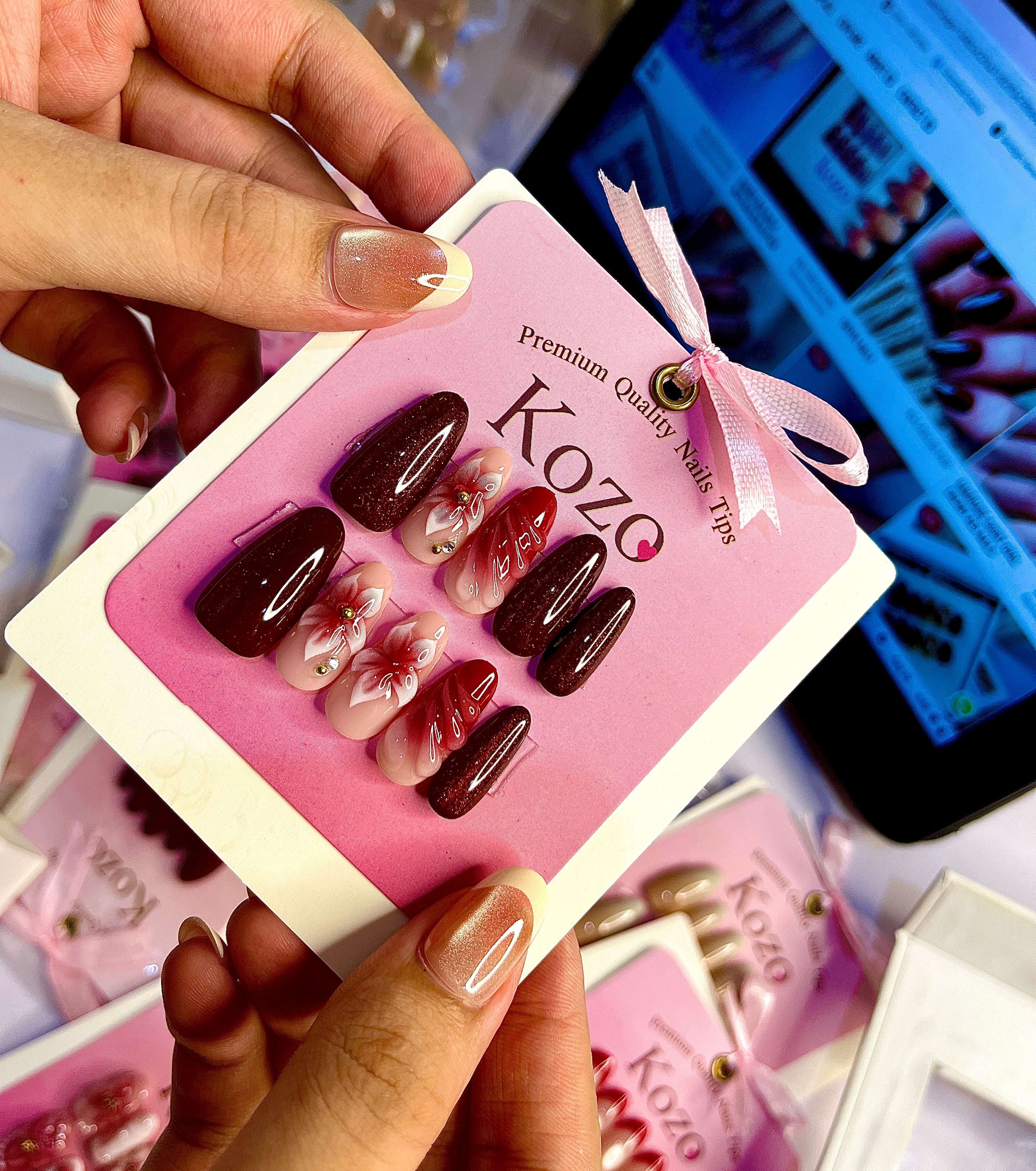 Red cat eye nails with 3D flowers