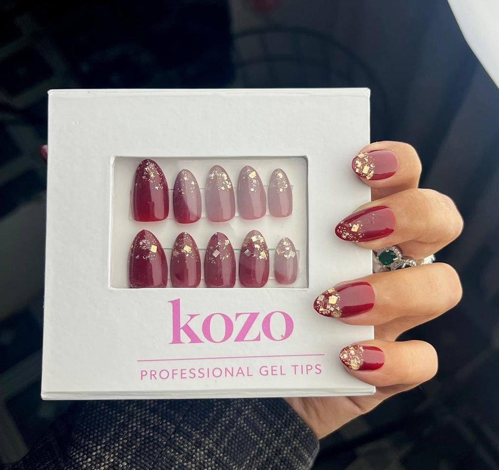 Cherry red nails with golden glitter