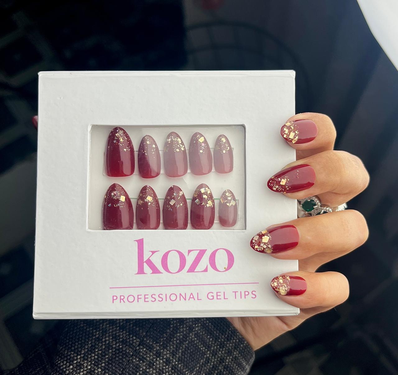 Cherry red nails with golden glitter